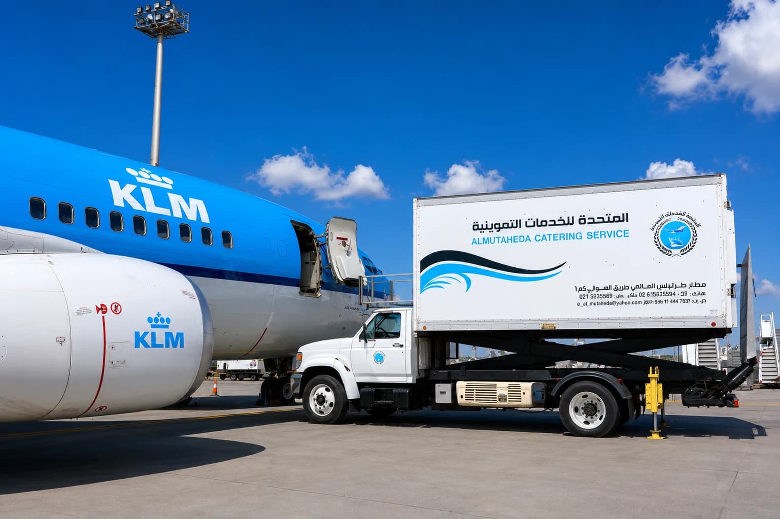 KLM aircraft beside a United catering truck